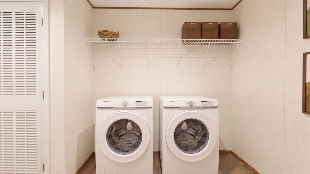 The REDWOOD Utility Room. This Manufactured Mobile Home features 5 bedrooms and 3 baths.
