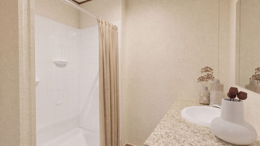 The SPRUCE Primary Bathroom. This Manufactured Mobile Home features 3 bedrooms and 2 baths.